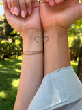 Split heart tattoo