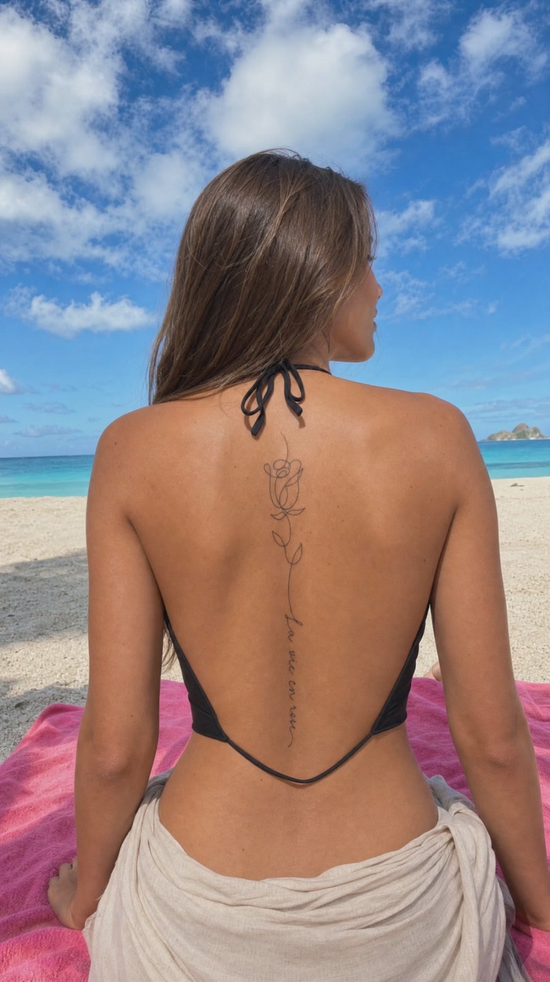 “La vie en rose” spine tattoo